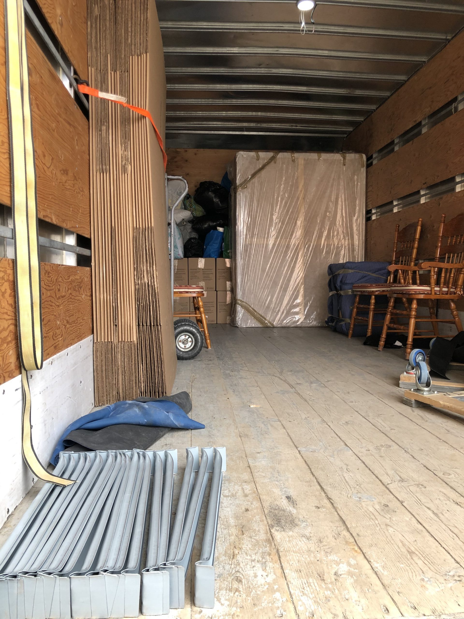 alt="Inside the back of a moving truck"